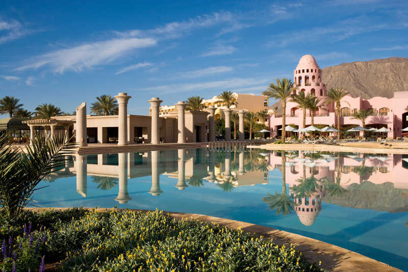 An overview of Mosaique Beach Resort with a view to the pool
