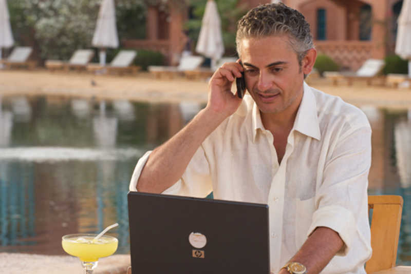 A businessman handles his work from Mosaique Beach Resort in Taba Heights