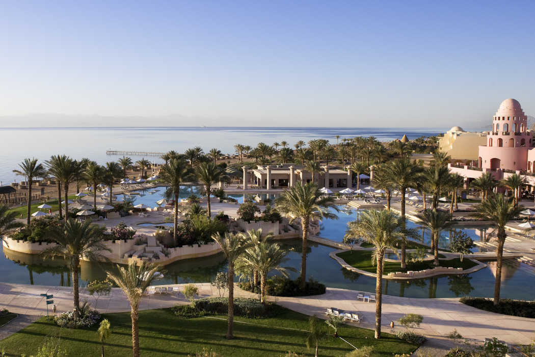 The hotel top view of Mosaique beach resort shows the pools, sea shore and gardens in Taba Heights Resort