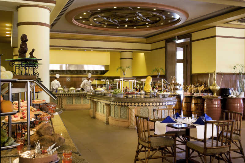 An overview of Alaadin Restaurant the international restaurant with an open buffet and chefs cook fresh meals at Mosaique Beach Resort in Taba Sinai